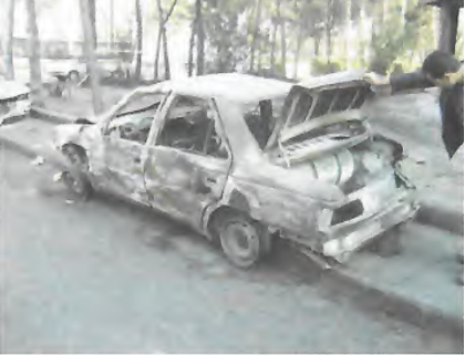 Photo: Aftermath of an aeroplane crash in Iran (2005). A CNG vehicle nearby remained intact; the cylinder's safety device functioned properly, preventing any explosion or rupture.