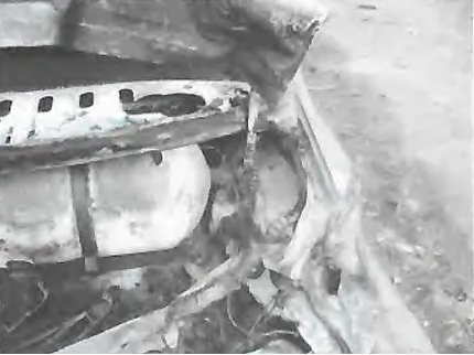 Photo: Aftermath of an aeroplane crash in Iran (2005). A CNG vehicle nearby remained intact; the cylinder's safety device functioned properly, preventing any explosion or rupture.